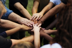 Group of people with their hands together