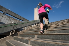 woman jogging on  steps